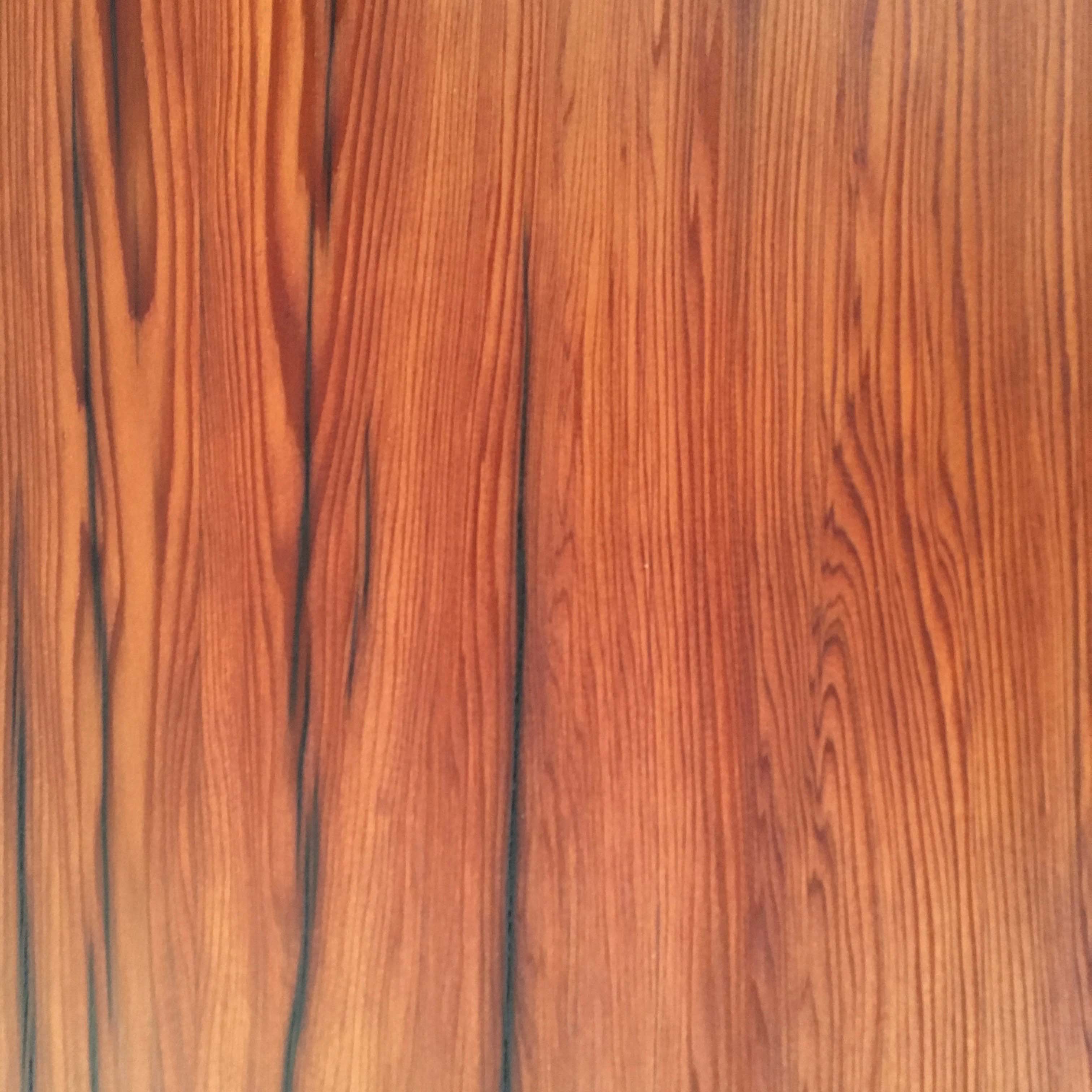 Redwood keyboard cover with warm red natural grain